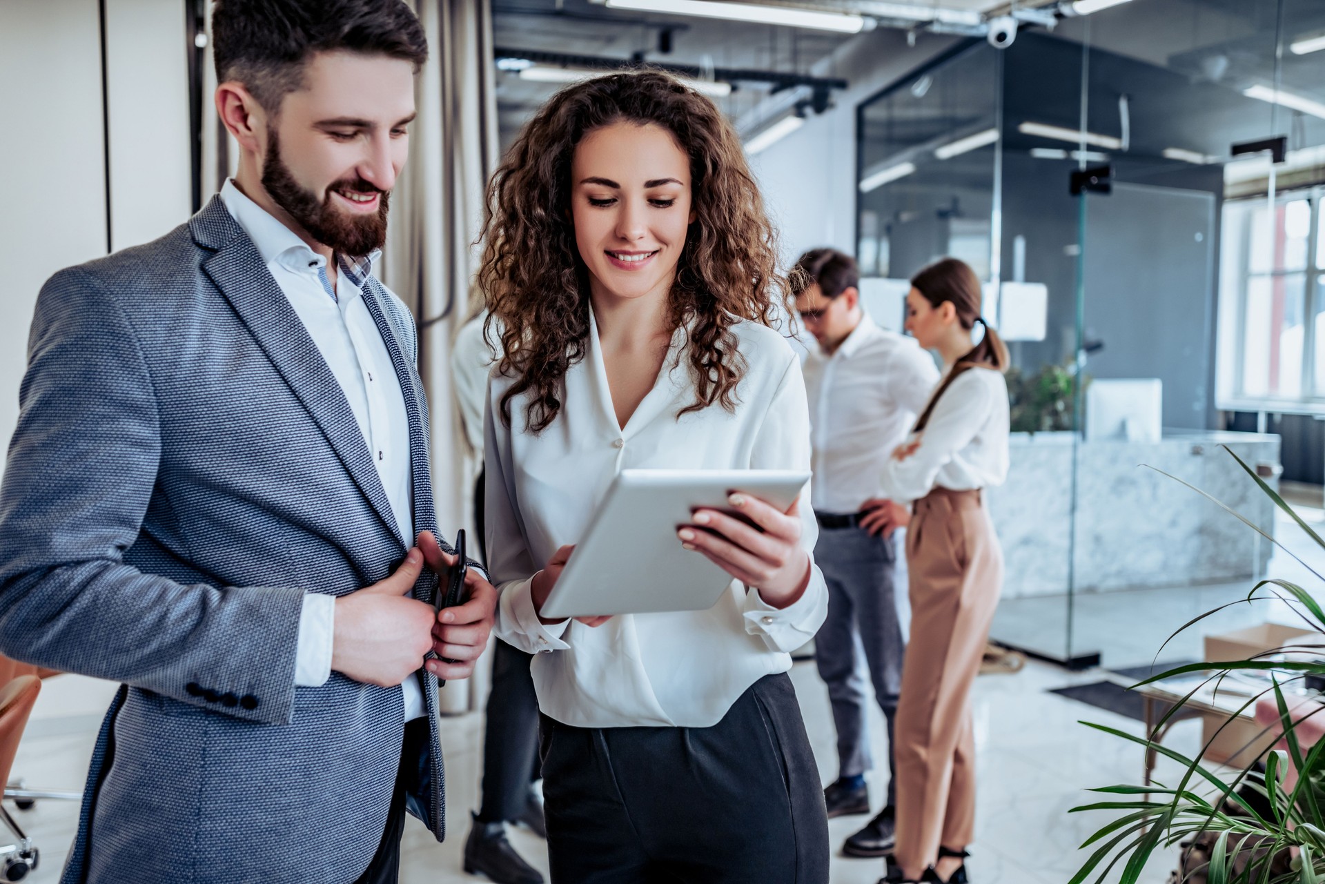 Business people having fun and chatting at workplace office